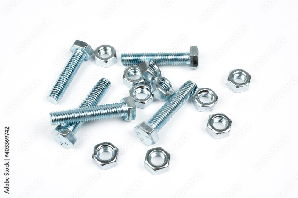 metal nuts and bolts on a white background metal nuts and bolts on a white background