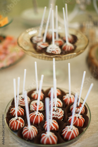 Candy bar. Sweets. Cupcakes with berries. Lollipop.