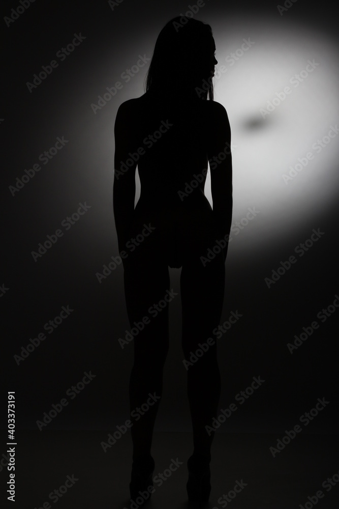 Black and white silhouette of a young woman.