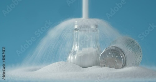 A jet of salt falls on a jar. 