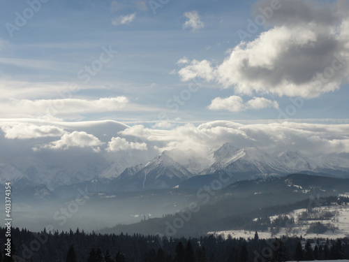 Fototapeta Naklejka Na Ścianę i Meble -  The view from Rzepiska to the clouds over Tatra Mountains.