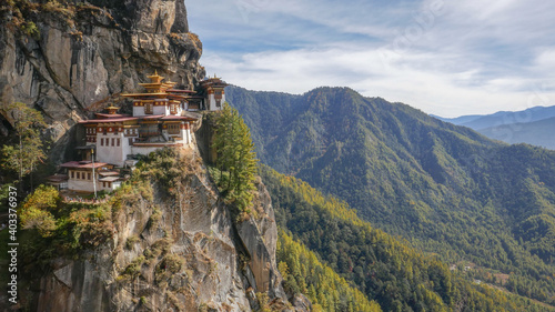 Panorama of Paro Taktsang buddhist monastery aka Tiger's Nest in western Bhutan with surrounding forest landscape photo