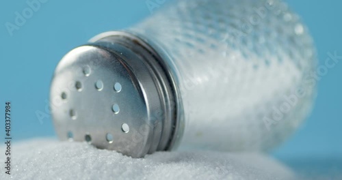 The glass jar with salt slowly rotates. 