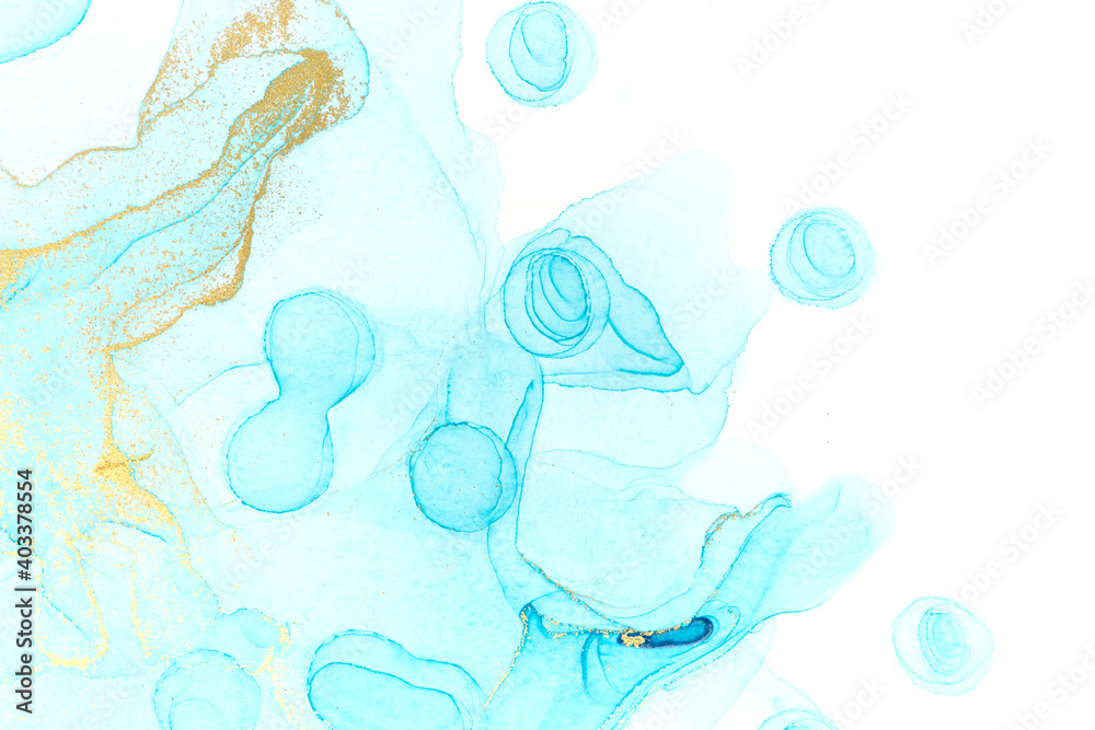 Chaotically splattered light blue transparent ink drops on white background. Abstract watercolor texture with gold parts.