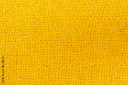 Yellow gold cotton fabric cloth texture for background, natural textile pattern.
