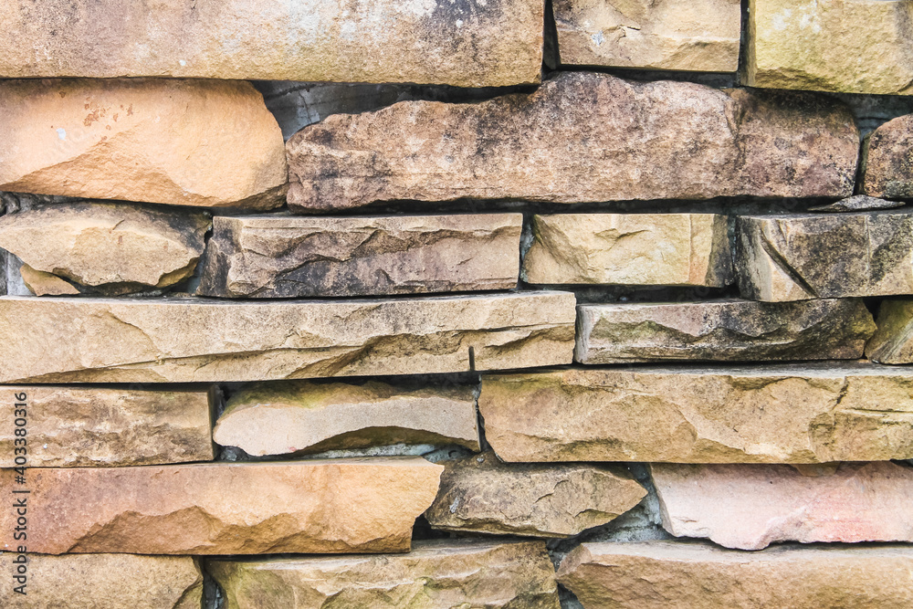 close up old brick wall texture background , brickwork or stonework grid uneven bricks design stack. close up old brick wall texture background , brickwork or stonework grid uneven bricks design stack.