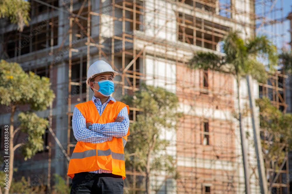 Engineer construction wearing protective mask the spread of Covid 19 diseases during the inspection in construction site. Safety concept Engineer construction wearing protective mask the spread of Covid 19 diseases during the inspection in construction site. Safety concept