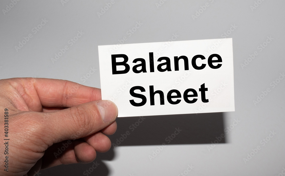 Message on the card BALANCE SHEET in hands of businessman. Message on the card BALANCE SHEET in hands of businessman.
