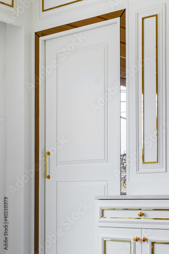 Luxury white room wall with gold border and door