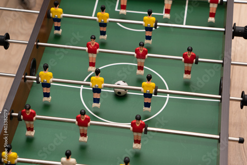 Soccer table game with red and yellow players close-up. © IvanMel