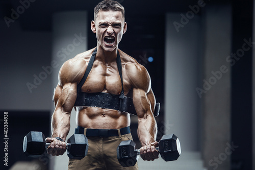 Energy caucasian strong athlete screaming in gym