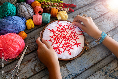 Making embroidery canvas on the table. Hand made concept with etamine photo