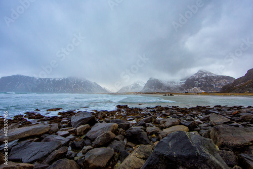 Beautiful landscape. Lofoten Islands. Stones against the backdrop of mountains and clouds.