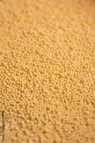 Couscous grains pile macro close up shallow depth of field top view