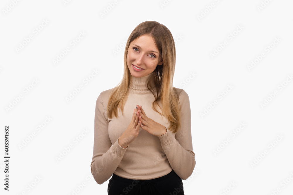 Pleasant young blond woman hold hands on heart thanking for compliments or praises. Studio shot, white background Pleasant young blond woman hold hands on heart thanking for compliments or praises. Studio shot, white background