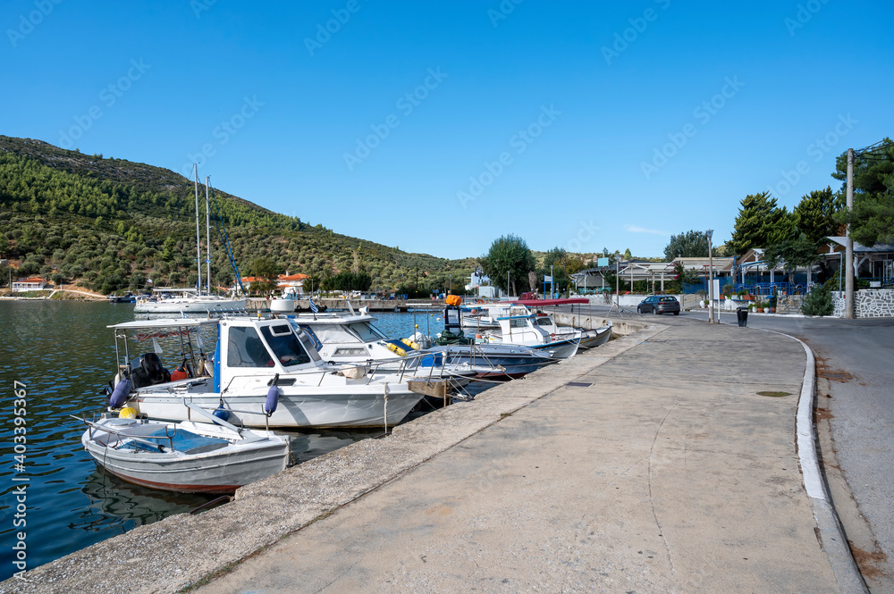 Moored boats near a village in Greece