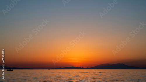 Sunset on the Aegean sea coast in Greece © frimufilms