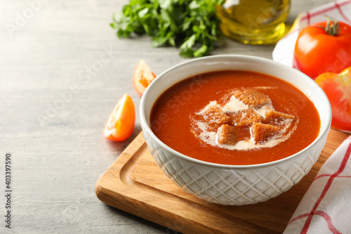 Obraz na plátně Concept of tasty food with tomato soup on gray background