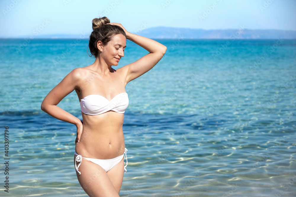 A woman on the beach in Greece