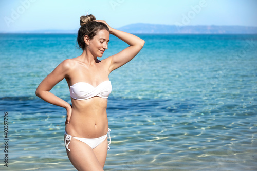 A woman on the beach in Greece © frimufilms