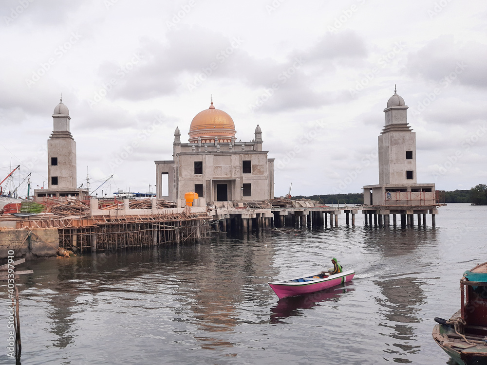 the construction stage of a floating mosque built over the sea, Bontang City, East Kalimantan, Indonesia