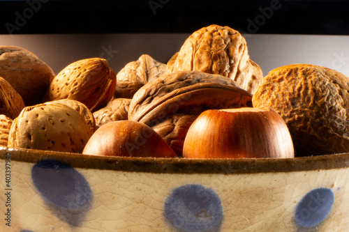 Bowl of mixed nuts in their shells