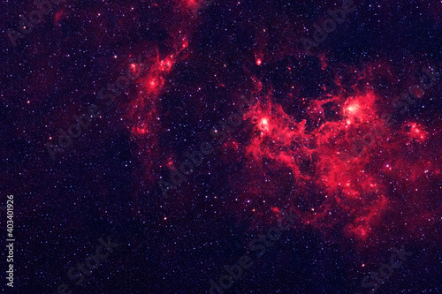 A bright, red galaxy. Elements of this image were furnished by NASA.
