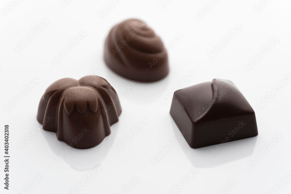Closeup shot of tasty chocolate candies on white background Closeup shot of tasty chocolate candies on white background