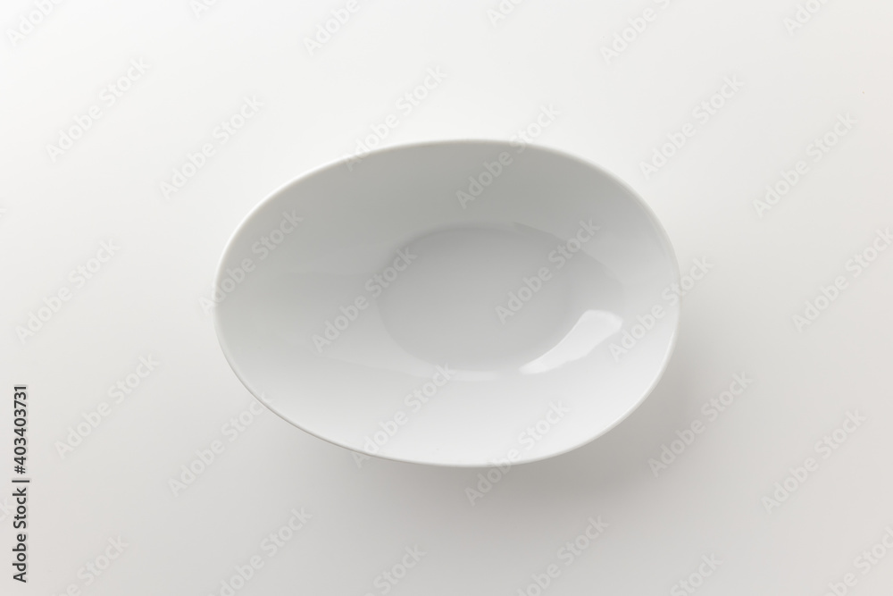 Top view White bowl on a white table. Household equipment Top view White bowl on a white table. Household equipment