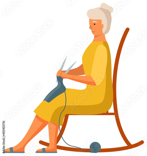 Elderly woman is knitting a scarf isolated on white background. Person works with threads. Female character sitting on rocking chair with knitting needles in hands. Woman looks at hand-made product