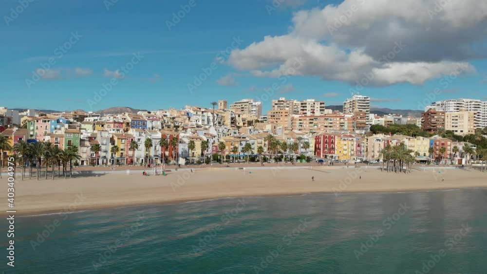 Aerial drone point panoramic view coastline and La Vila Joiosa Villajoyosa touristic resort townscape view from top, sandy beach and mediterranean seascape. Province of Alicante, Costa Blanca, Spain
