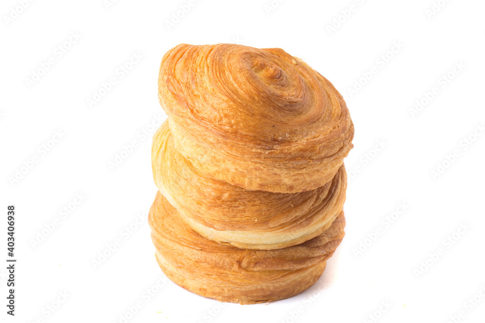 pyramid of three homemade baking. Sweet round bun roll swirl, isolated on a white background, close-up pyramid of three homemade baking. Sweet round bun roll swirl, isolated on a white background, close-up