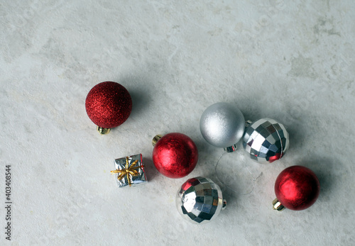 red silver christmas balls on neutral background. Copy space.