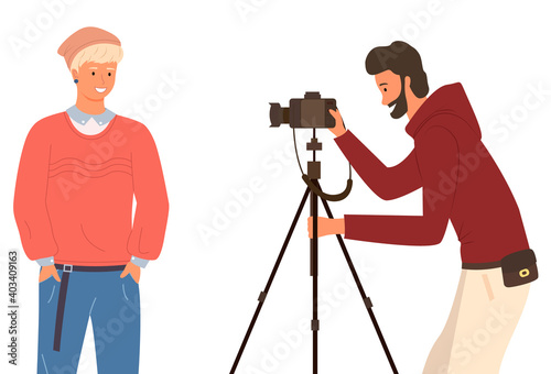Photographer taking a picture of a young man in casual clothes and a cap, flat vector Illustration. Person with photo camera on white background using stand for photocamera makes a portrait for guy
