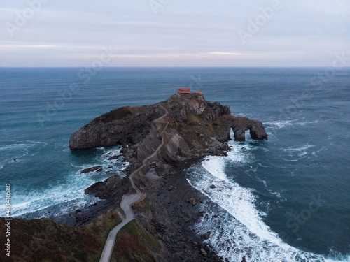 Aerial panorama of Gaztelugatxe islet rock castle hermitage chapel footbridge island Bermeo Basque Country Spain photo