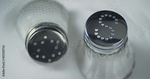 Cans of salt rotate slowly. 