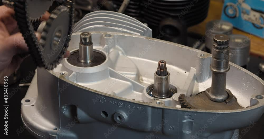 Motorcycle restoration engine rebuild clutch basket assemble in garage workshop Motorcycle restoration engine rebuild clutch basket assemble in garage workshop