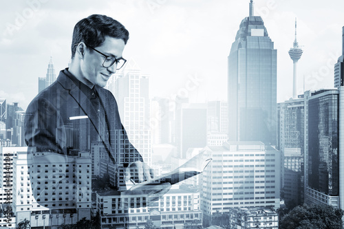 Photography Young handsome businessman in suit and glasses thinking how to tackle the problem, new career opportunities, MBA assignment