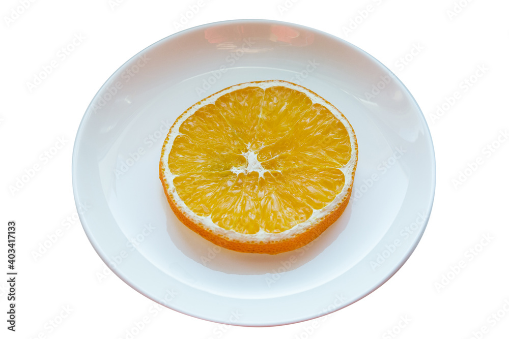 Plate with one slice of dried orange isolated on white background. Plate with one slice of dried orange isolated on white background.