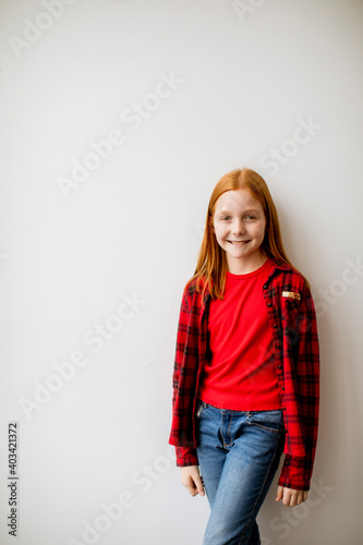 Little red hair girl standi...