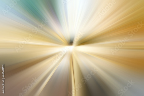 Abstract surface of gold, white and gray tones of radial blurzoom. Abstract golden background with radial, diverging, converging lines. 