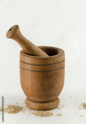 wooden mortar with organic aromatic seeds