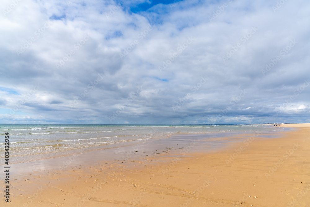 beautiful wide empty golden sand beach