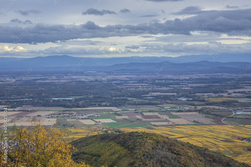 Fototapeta premium Picturesque French landscape - aerial view from the Haut-Koenigsbourg Castle. Valley, small towns and mountains in the background in the Bas-Rhin departement of Alsace, France.
