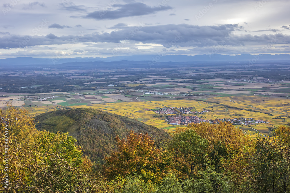 Picturesque French landscape - aerial view from the Haut-Koenigsbourg Castle. Valley, small towns and mountains in the background in the Bas-Rhin departement of Alsace, France.