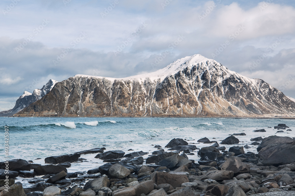 Beautiful landscape. Lofoten Islands. Sea, stones, mountains and clouds.