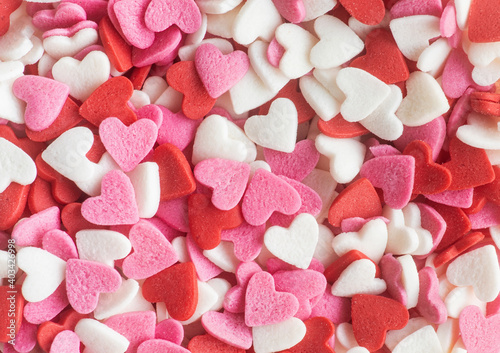 Red white and pink heart shapes sprinkles background
