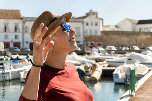 Woman enjoying sunny day in Faro, Algarve, Portugal