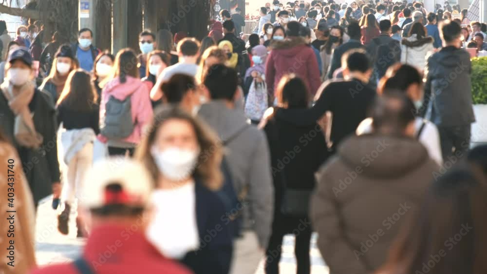 Slow motion of crowd people wearing medical face masks at metro in Hong Kong. Coronavirus concept	