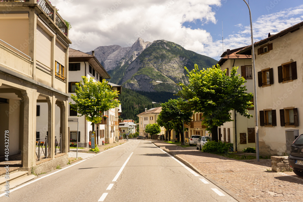 Small street in a little town in Europe surrounded by mountains